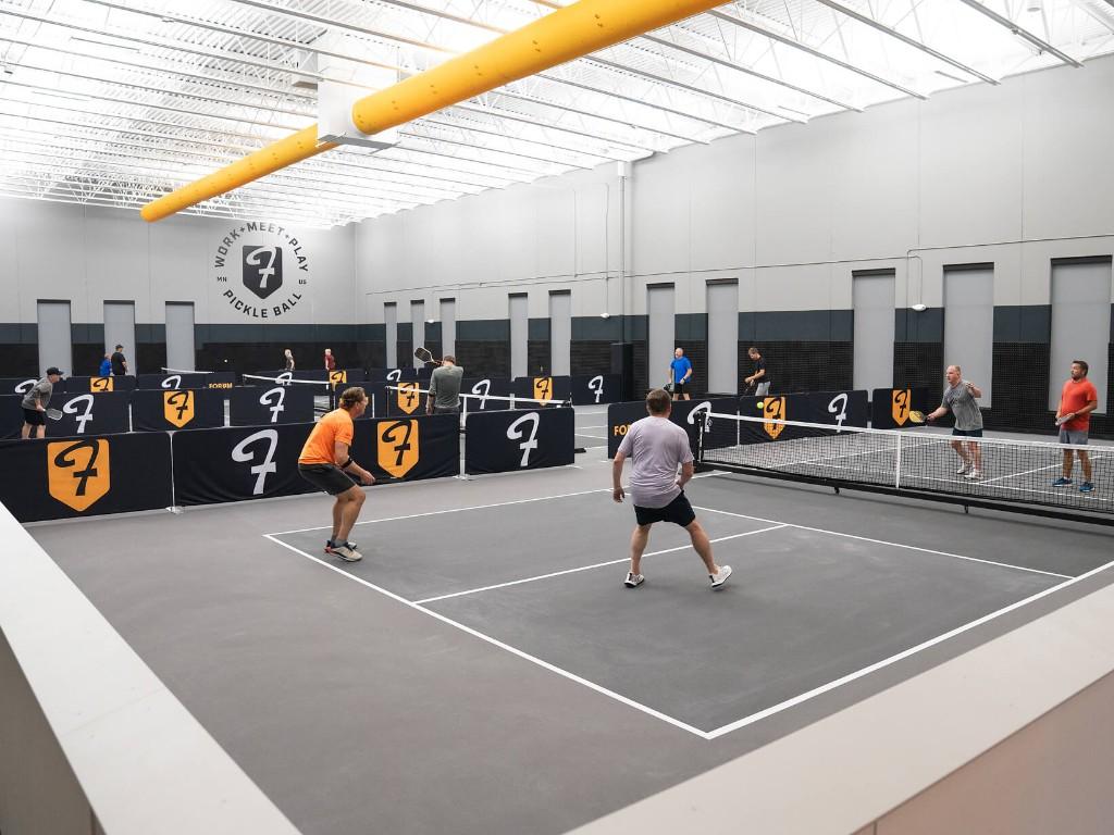 Forum Delano indoor pickleball courts with digital scoreboards and instant replay